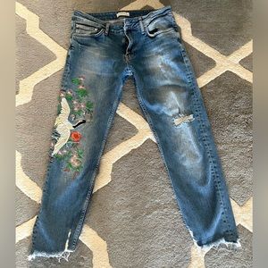 Zara jeans embroidered with crane and flowers